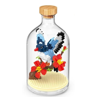 vogel met bloemen in fles