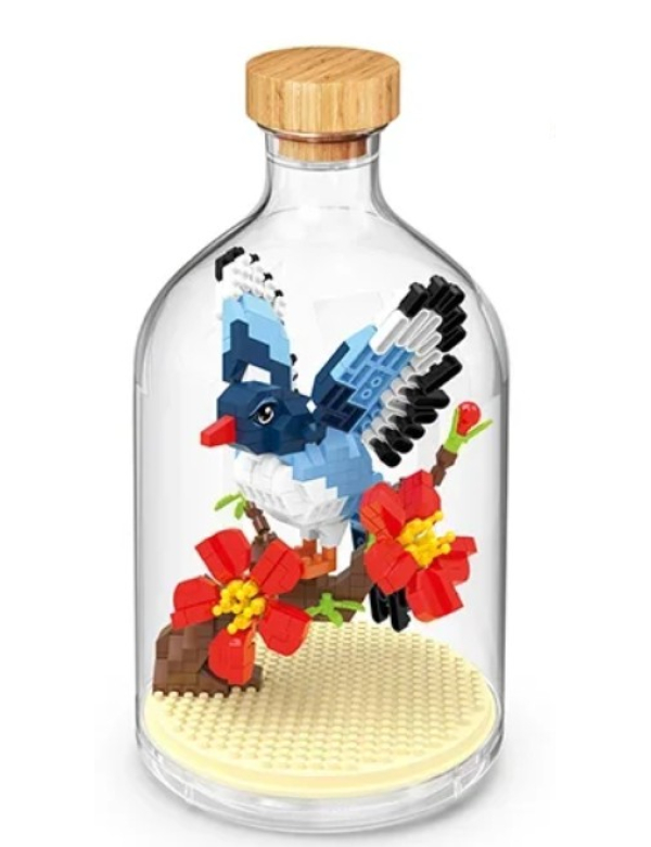 vogel met bloemen in fles